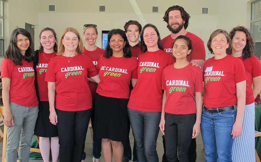 A group of people wearing shirts that read, 'Cardinal Green'