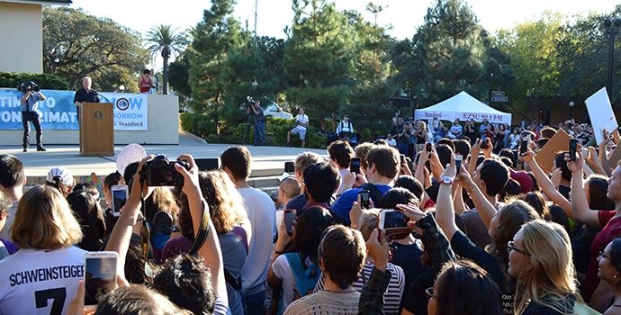 students listening to Al Gore at rally