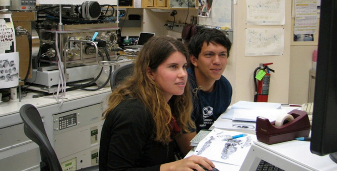 Students looking at computer monitor