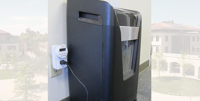 paper shredder plugged into equipment timer