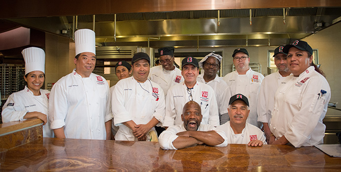 chefs standing in kitchen