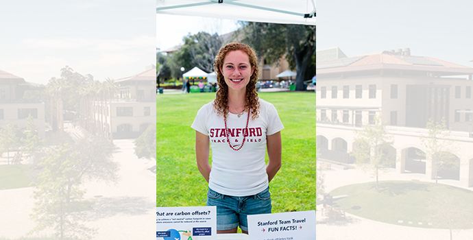 student athlete standing at information table