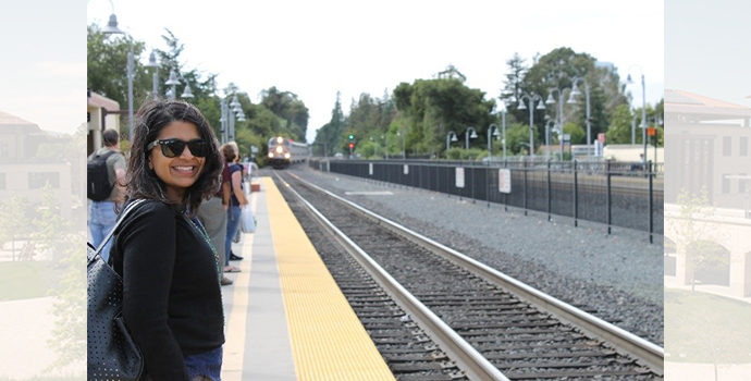 student at train tracks