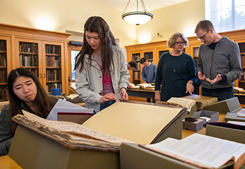 People looking at rare books