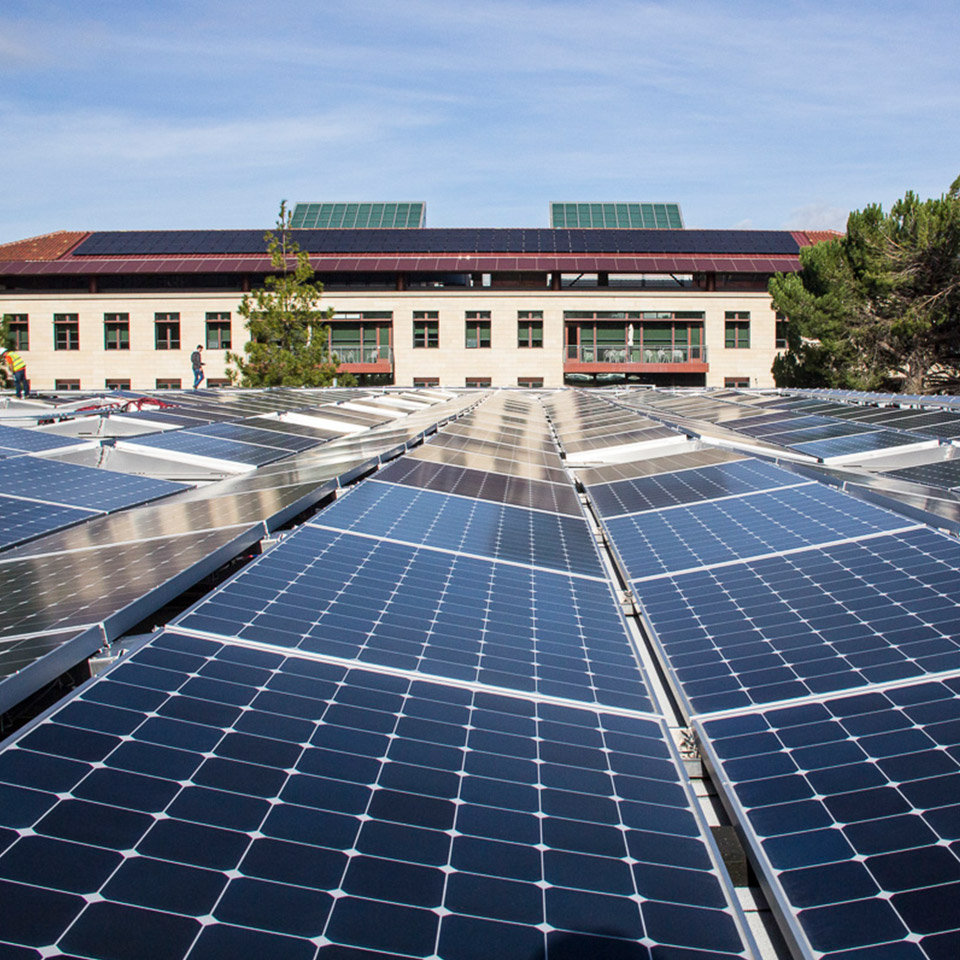 Solar panel array next to Stanford Building