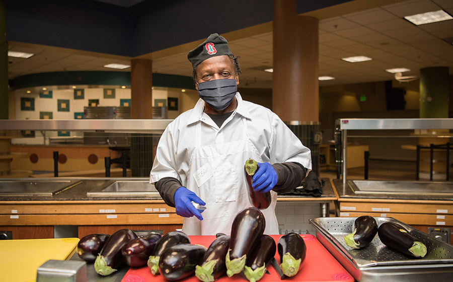 Food service employee collecting trash