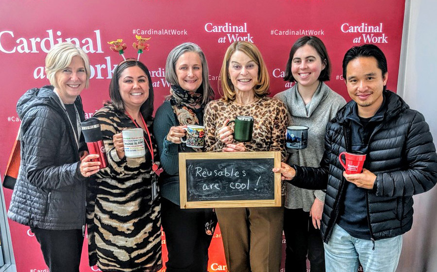 Group each holding their own reusable mug