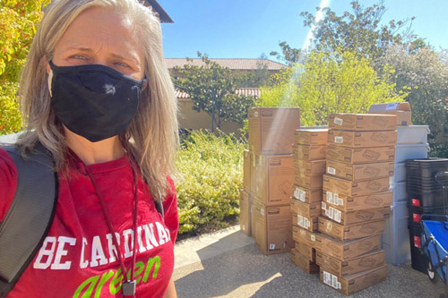  Julie Muir delivering new waste bins to campus