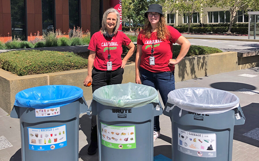 Julie and Laura with three different types of waste bins