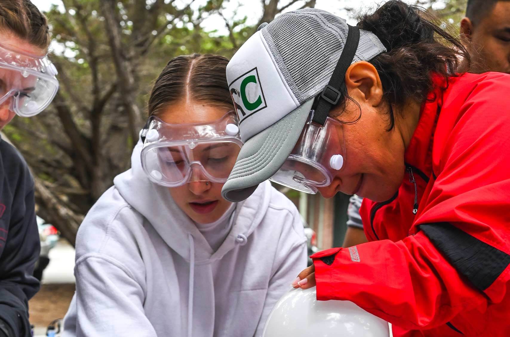 PCJ Fellow students wearing safety goggles while working on Climate Resilient Communities.