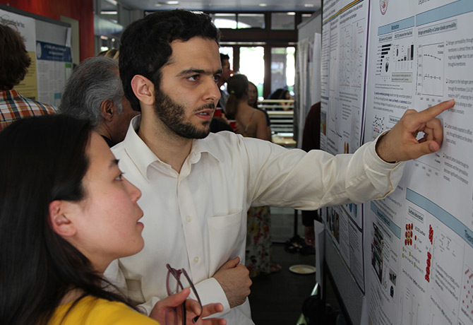 Two people looking at report