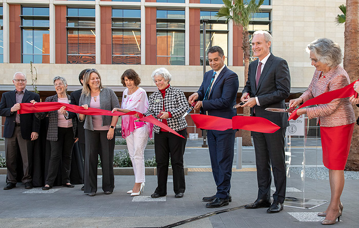 People cutting ribbon