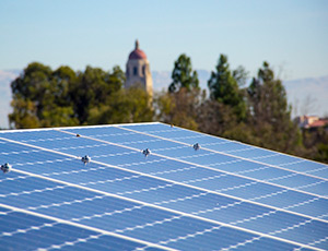 Solar panel with bell tower in background